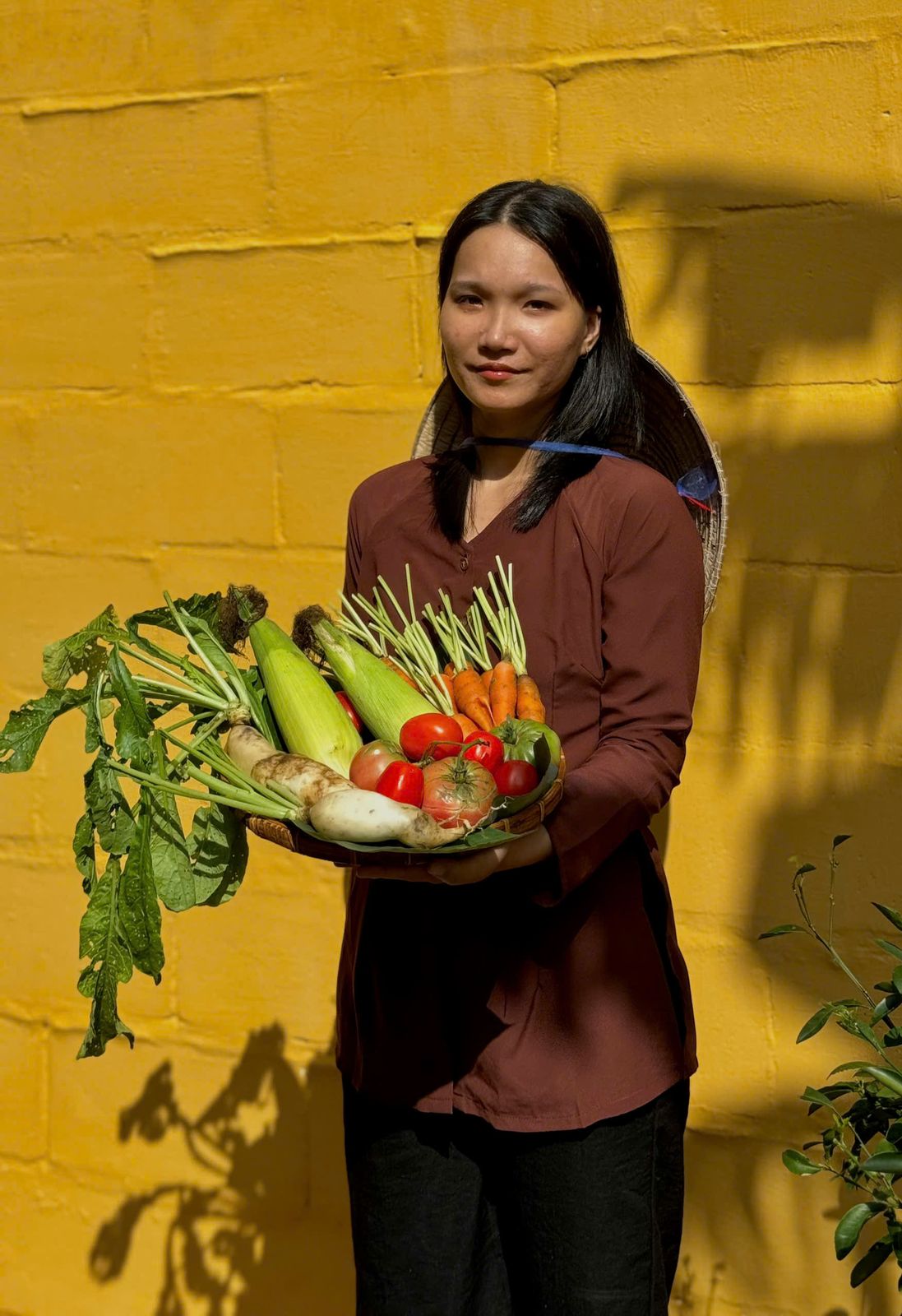 Our chef carrying a basket of vegetables from the morning market